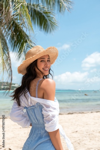 Woman Stands on Beach in Sunny Weather Wearing Hat and Enjoying the View of W...
