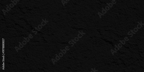 A dark grey grunge asphalt texture background features a rough macro surface with a seamless black material pattern for a dirty stone backdrop design