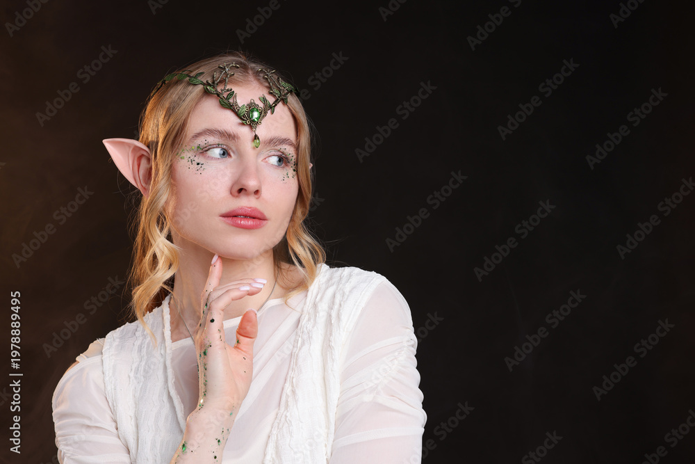 Naklejka premium Beautiful elf girl on black background with smoke, space for text