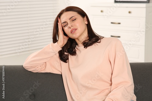 Bild auf Leinwand Young woman suffering from headache indoors. Hormonal disorders