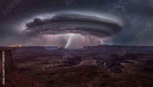 Desolate desert canyon under a massive lightning thunderstorm