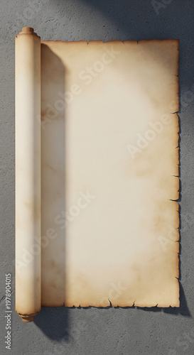 Blank unrolled vintage parchment scroll with burnt edges on a gray stone wall background. Antique paper mockup with wooden rollers and dramatic shadows for historical and mysterious message concepts.