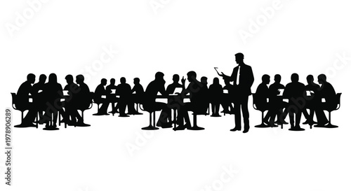 Silhouette of a business speaker presenting to a large audience at a corporate seminar