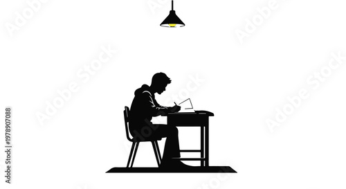 Silhouette of focused young man sitting at desk working on laptop computer in modern minimalist office space with industrial lighting