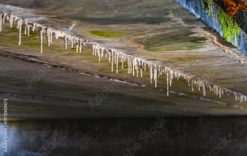 Принти на полотні close-up of anthropogenic stalactites forming on a concrete ceiling