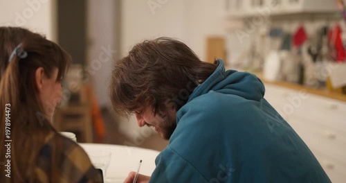 Joyful friends share laughter and ideas as they collaborate in a warm, sunlit kitchen filled with creativity and smiles