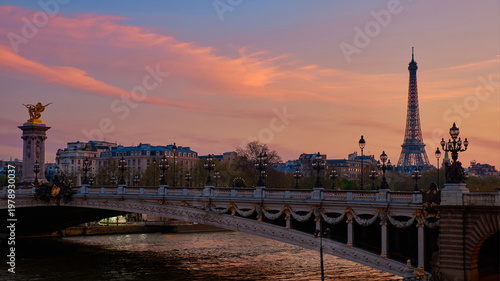Eiffel Tower and Pont Alexandre III at spring sunset over Seine river in Paris
