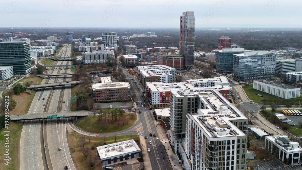 Obraz premium Drone view of Charlotte NC roadway corridor and modern city blocks