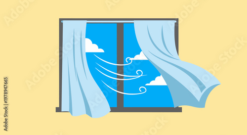 A blue curtain blowing in the wind.