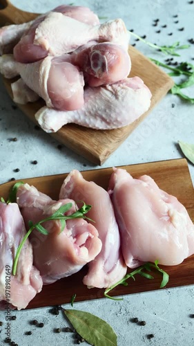 Fresh chicken pieces ready for preparing a flavorful meal on a rustic wooden cutting board