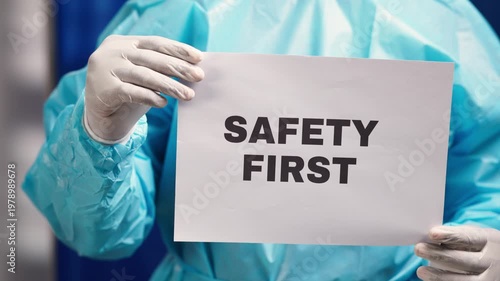 Safety first, healthcare worker wearing protective gown and gloves, emphasizing prevention
