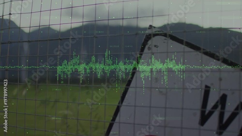 Revealing tilted metal road sign leaning behind fence at roadside with green waveform, copy space