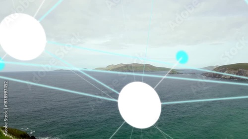 Bright white circular graphic node glowing and radiating cyan beams over grassy cliff and sea