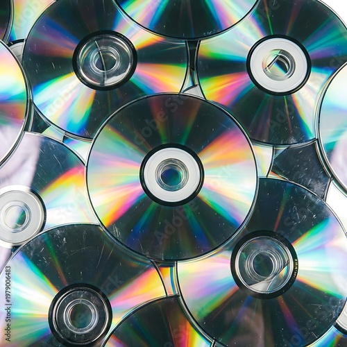 Macro compact discs pile overlapping circular geometric iridescent patterns abstract