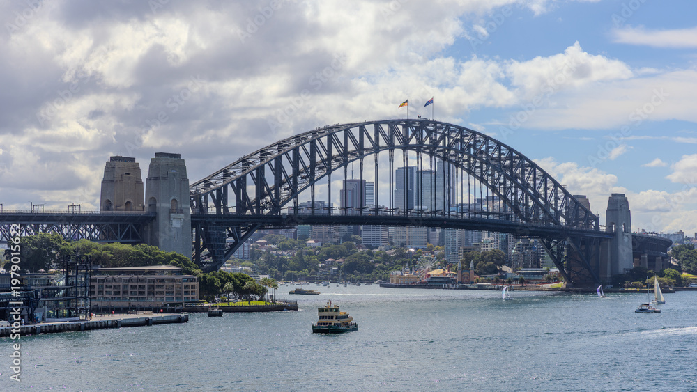 Obraz premium View of Sydney Harbour and Circular Quay and Sydney Harbour Bridge in on beautiful Autumn Afternoon beautiful colours in the Sky Sydney NSW Australia