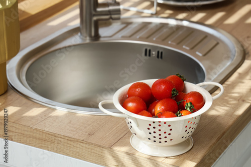 Colander with washed tomato...