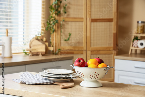 Colander with fruits and di...