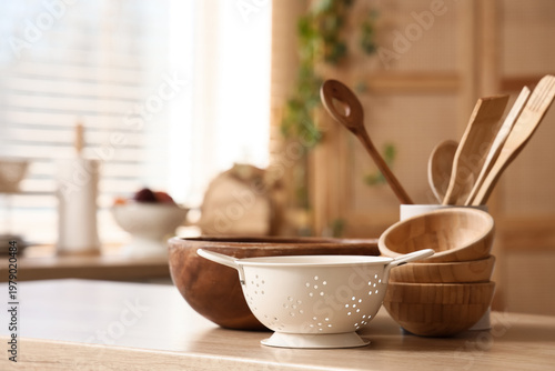 Colander with wooden utensi...