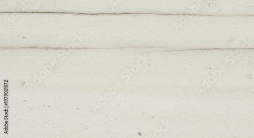Close-up view of a textured, light pink wall with subtle imperfections