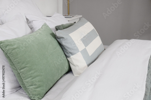 Stylish linen on bed in hot...