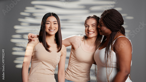 Photos Interracial group of models promoting body positivity and feeling confident, laughing and having fun in studio