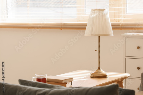Stylish lamp with books and...