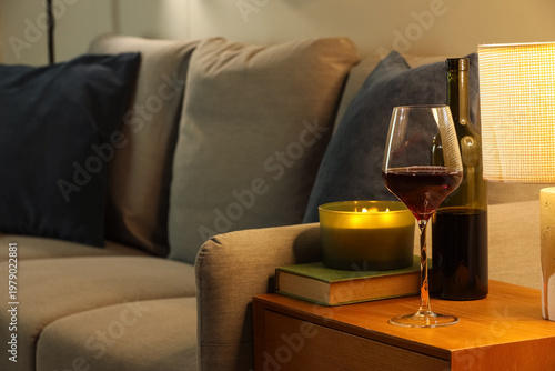 Red wine with burning candl...