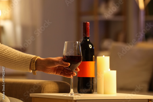 Female hand taking glass of...