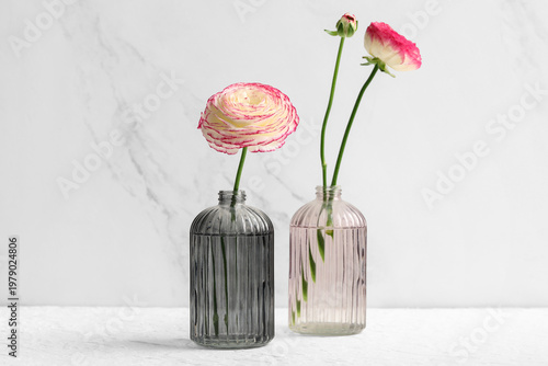 Vases with pink ranunculus ...