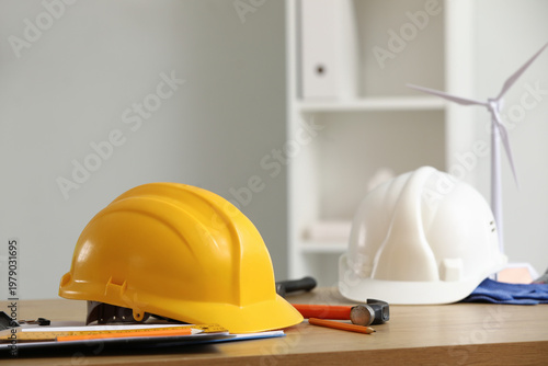 Hardhats with work tools on...