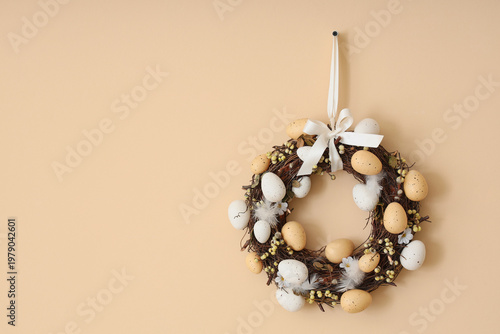 Easter wreath with eggs han...