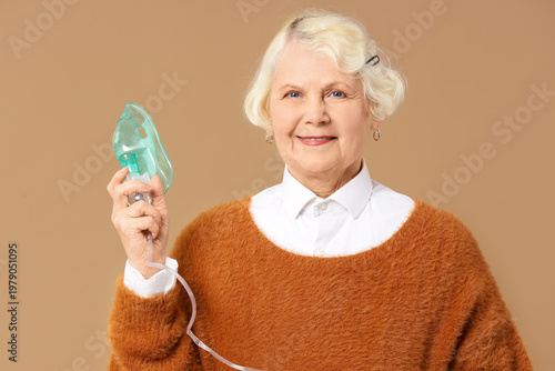Senior woman with nebulizer...