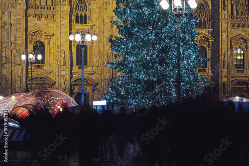night shot of the Duomo with the Christmas tree in the foreground, Milan, Italy