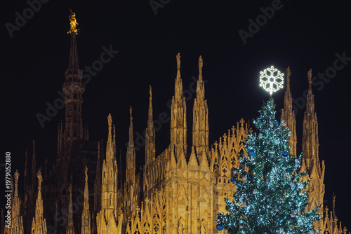 night shot of the Duomo with the Christmas tree in the foreground, Milan, Italy