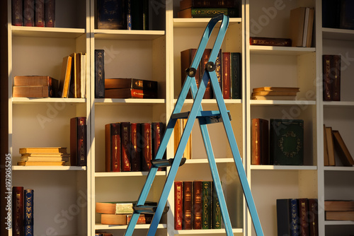 Stepladder near bookshelf i...