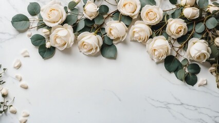 Horizontal wedding background with white roses and eucalyptus border on marble, large copy space for text