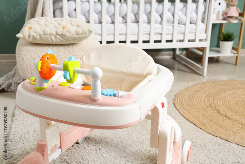 Baby walker on carpet in ch...