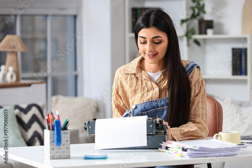 Female screenwriter using v...