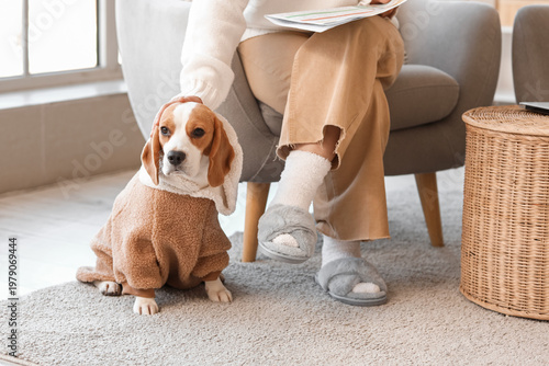 Woman in grey slippers with...