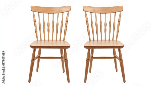 Two light wood dining chairs with spindle backs and turned legs