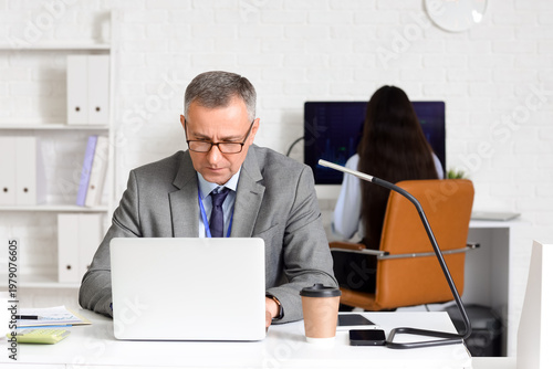 Male business analyst worki...