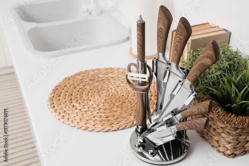 Set of knives on counter in...