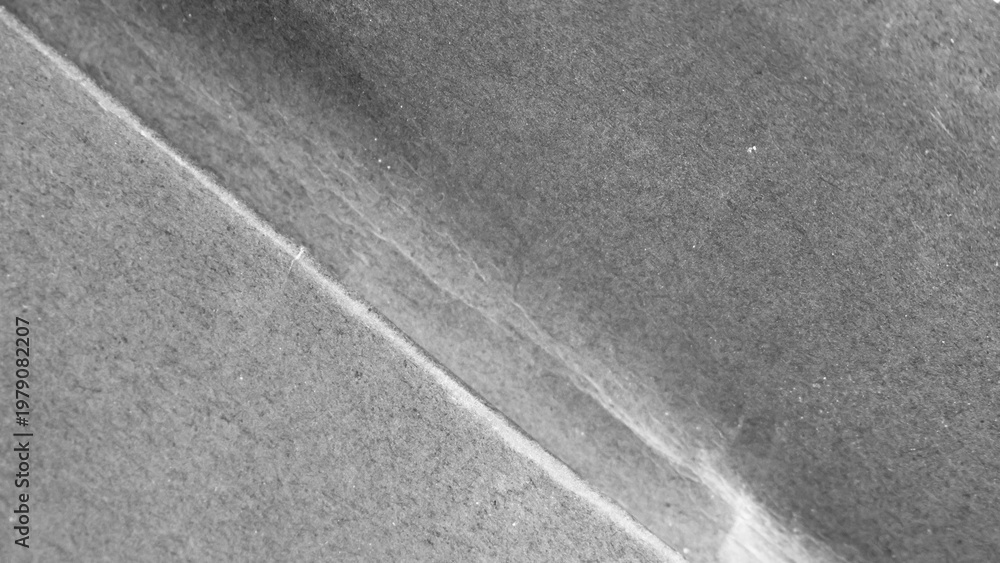 Fototapeta premium Black paper texture background close up. Top view.