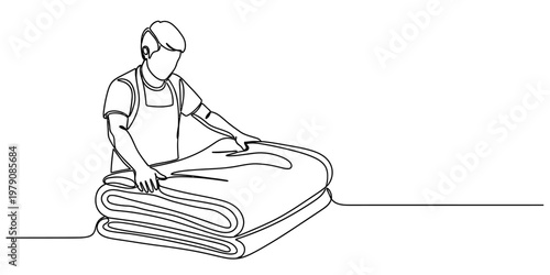 A single continuous line drawing of a person carefully folding a soft blanket on a flat surface.