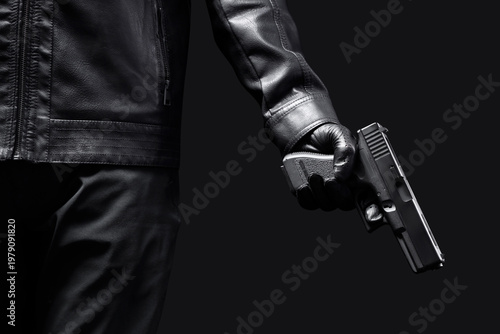 Принти на полотні Man with gun on black background, closeup
