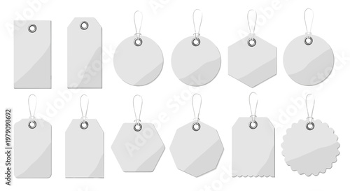 Blank white paper price tags set with hanging strings and silver eyelets for retail sale and product labeling