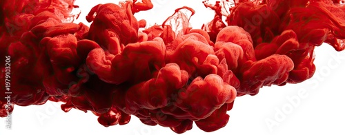A mass of vibrant red pigment plumes and swirls against a white backdrop