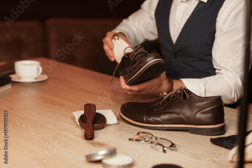 Man putting shoe tree into ...