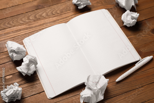 Notebook and crumpled piece...