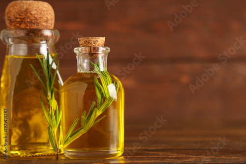 Bottles of rosemary cosmeti...
